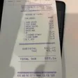 A printed receipt from Sparks listing sirloin, filet mignon, shrimp cocktail, cheesecake, drinks and sides with subtotal, tax and total.
